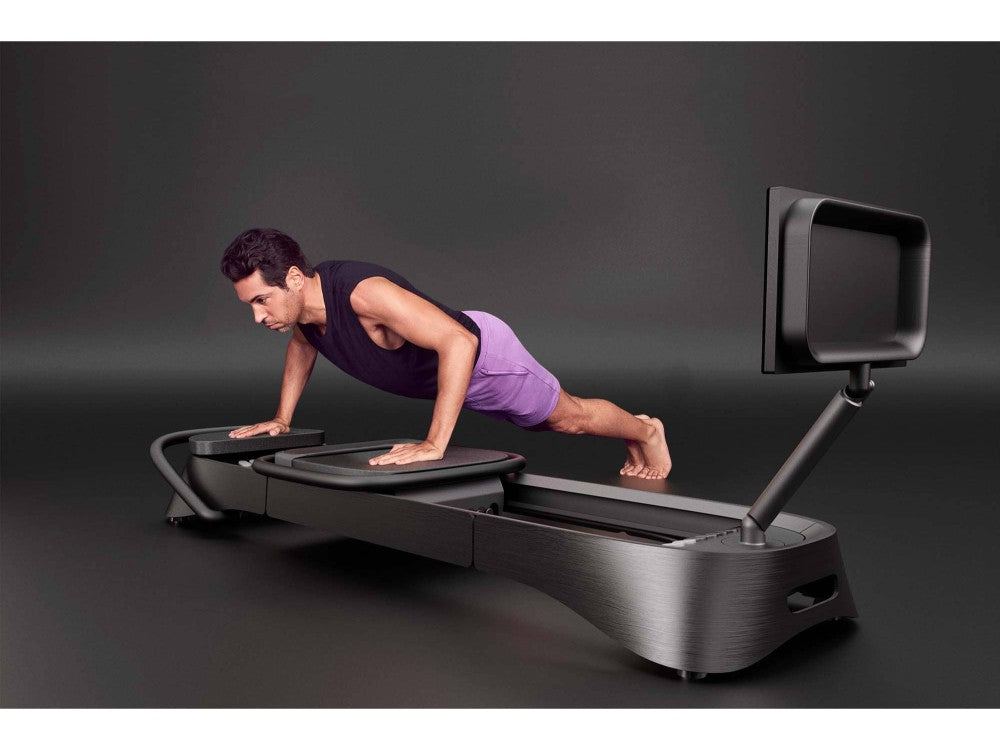 frame fitness pilates reformer midnight male exercise dark background