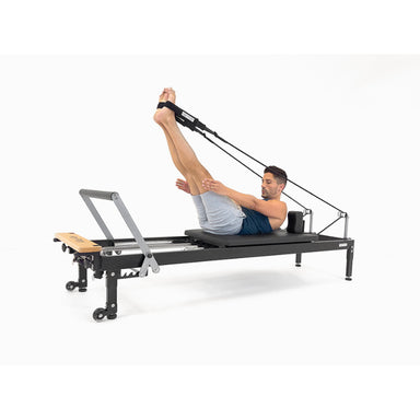 Align-Pilates H1 Home Pilates Reformer mens exercise ropes and straps diagonal view