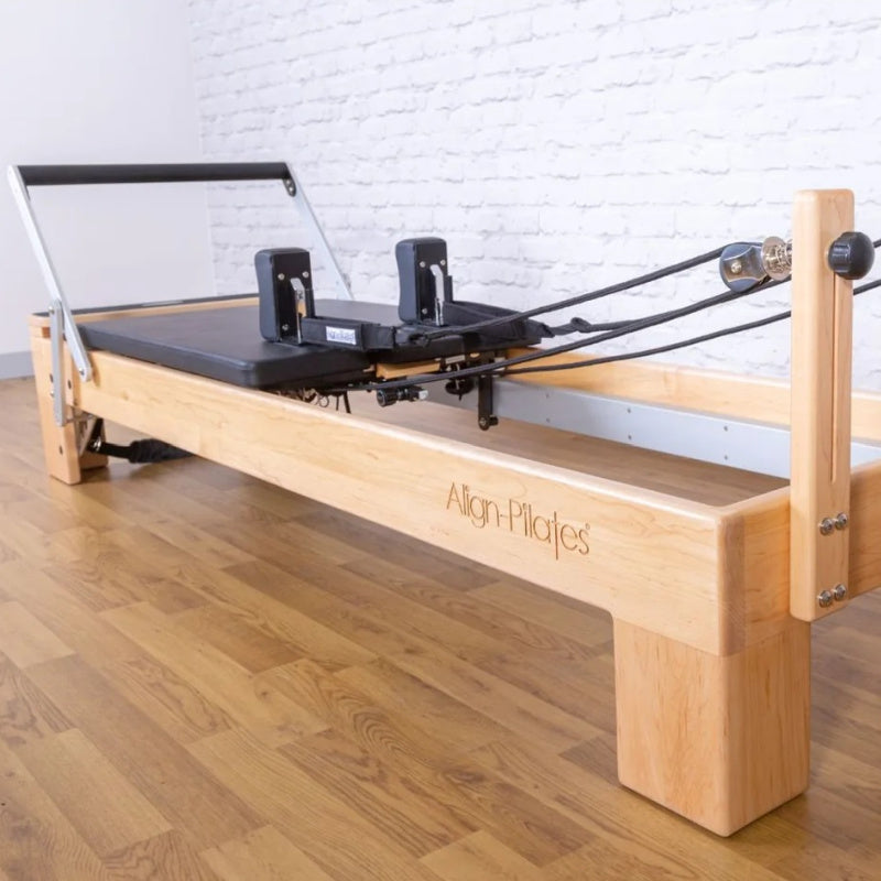 Align-Pilates M8-Pro RC Maple Wood Studio Reformer in studio diagonal view