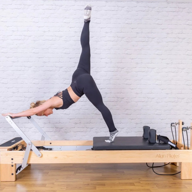 Align-Pilates-M8-Pro-Pilates-Reformer-side-view-lifestyle-leg-up