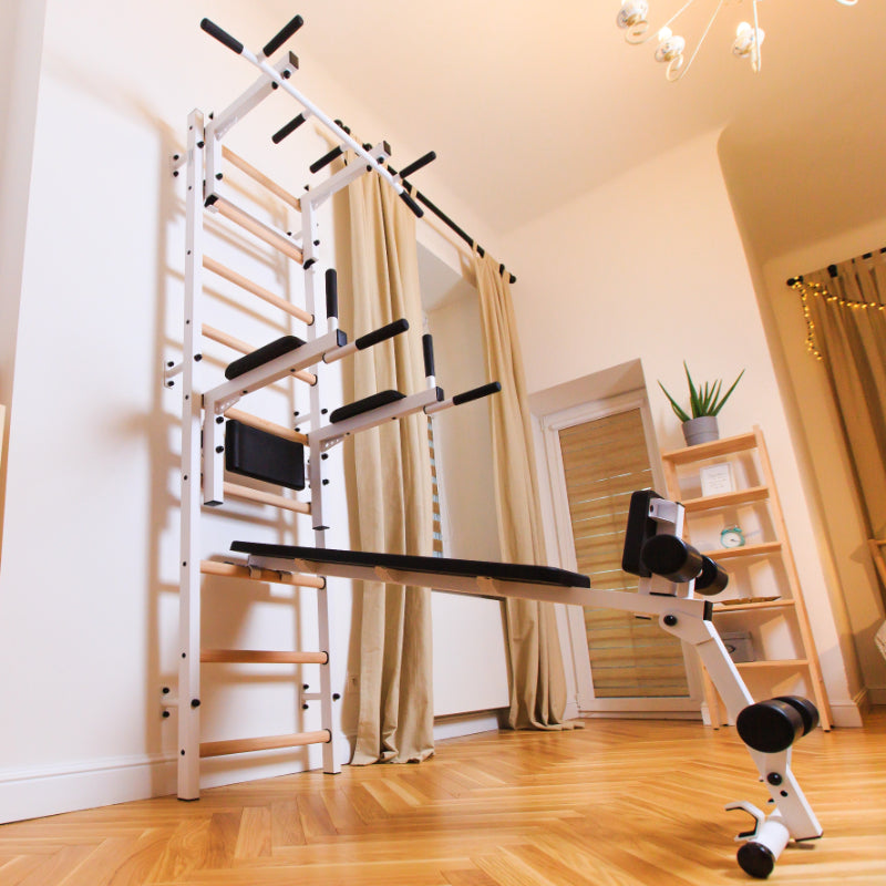 BenchK Swedish Ladder 733W With Bench Rack and Dip Bar in White with bench extended low view