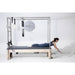 Elina Pilates Elite Cadillac Reformer grey upholstery model in studio laying