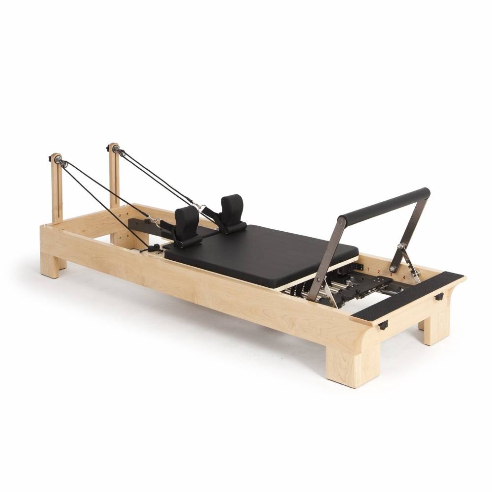 Elina Pilates Wood Reformer Black Upholstery Diagonal White Background