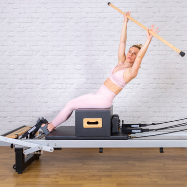 align pilates pro sitting box lifestyle blonde model with gondola