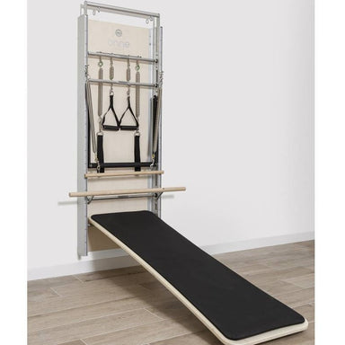 Elina Pilates Wall Board ONNE by eva espuelas fully equipped with ballet bar and mat table diagonal view solo