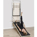 Elina Pilates Wall Board ONNE by eva espuelas fully equipped with ballet bar and mat table holding handles lying down exercise