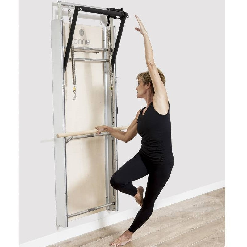 Elina Pilates Wall Board ONNE by eva espuelas fully equipped with ballet bar and mat table standing exercise diagonal view